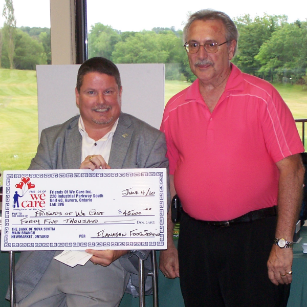 Jim Grieb from Flanagan's and Kevin Collins of We Care at the 22nd annual golf tournament